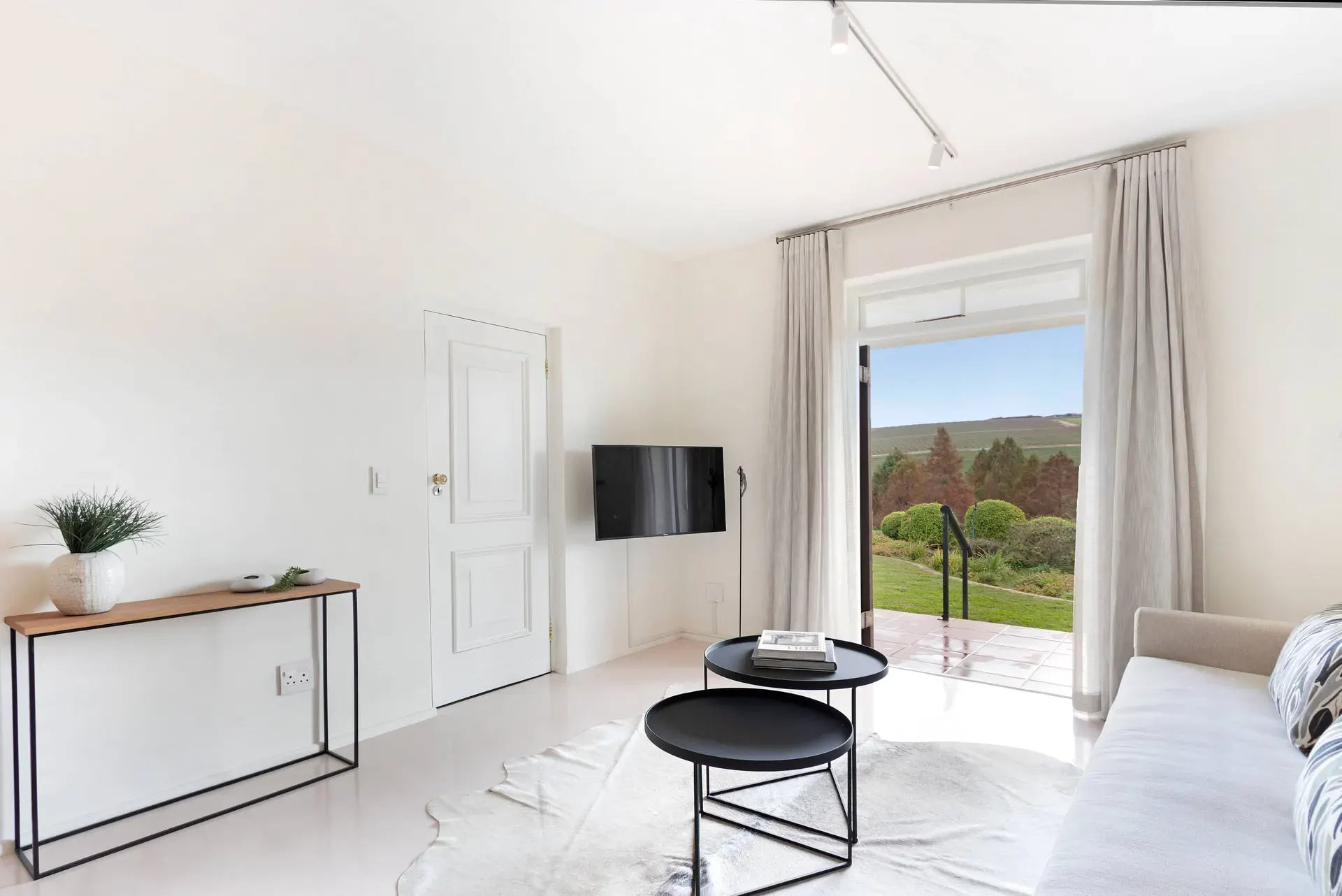 Lodge 5 open-plan lounge with golf fairway views