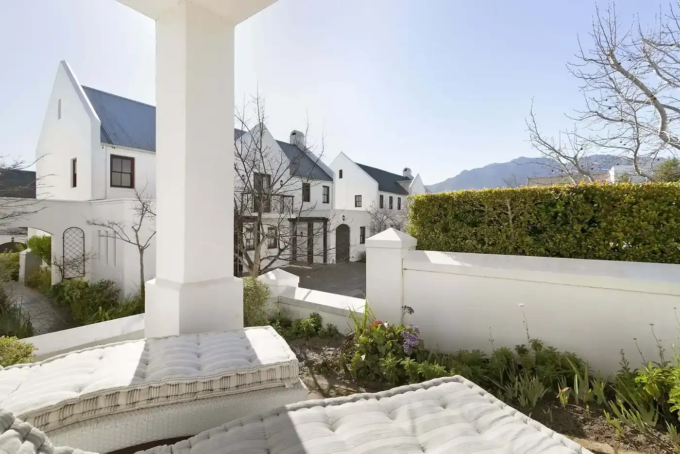 Lodge 33 outdoor patio with built-in braai with garden views