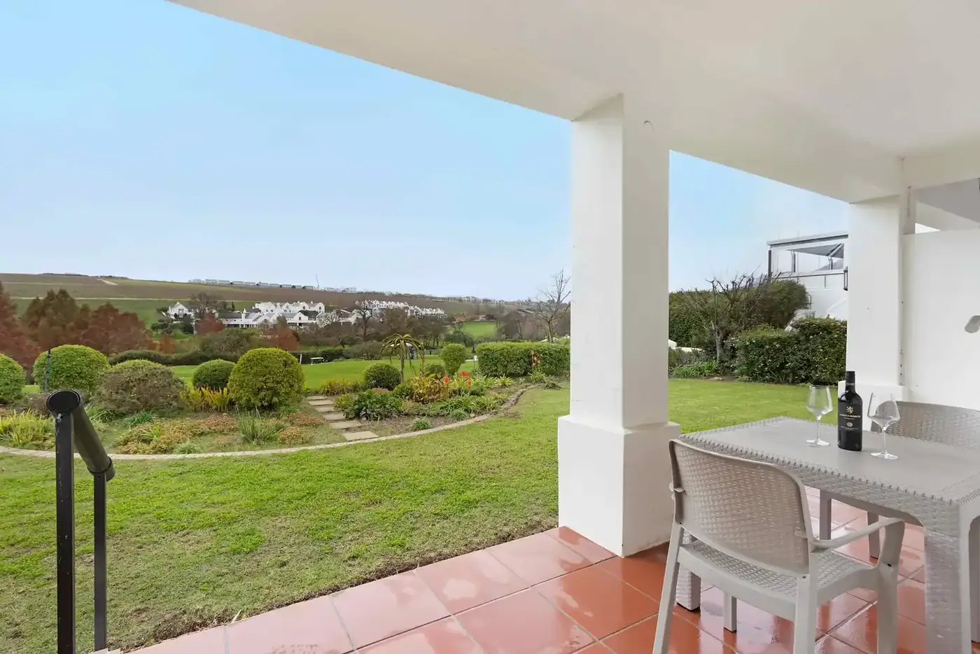 Lodge 5 outdoor patio with built-in braai with golf fairway views