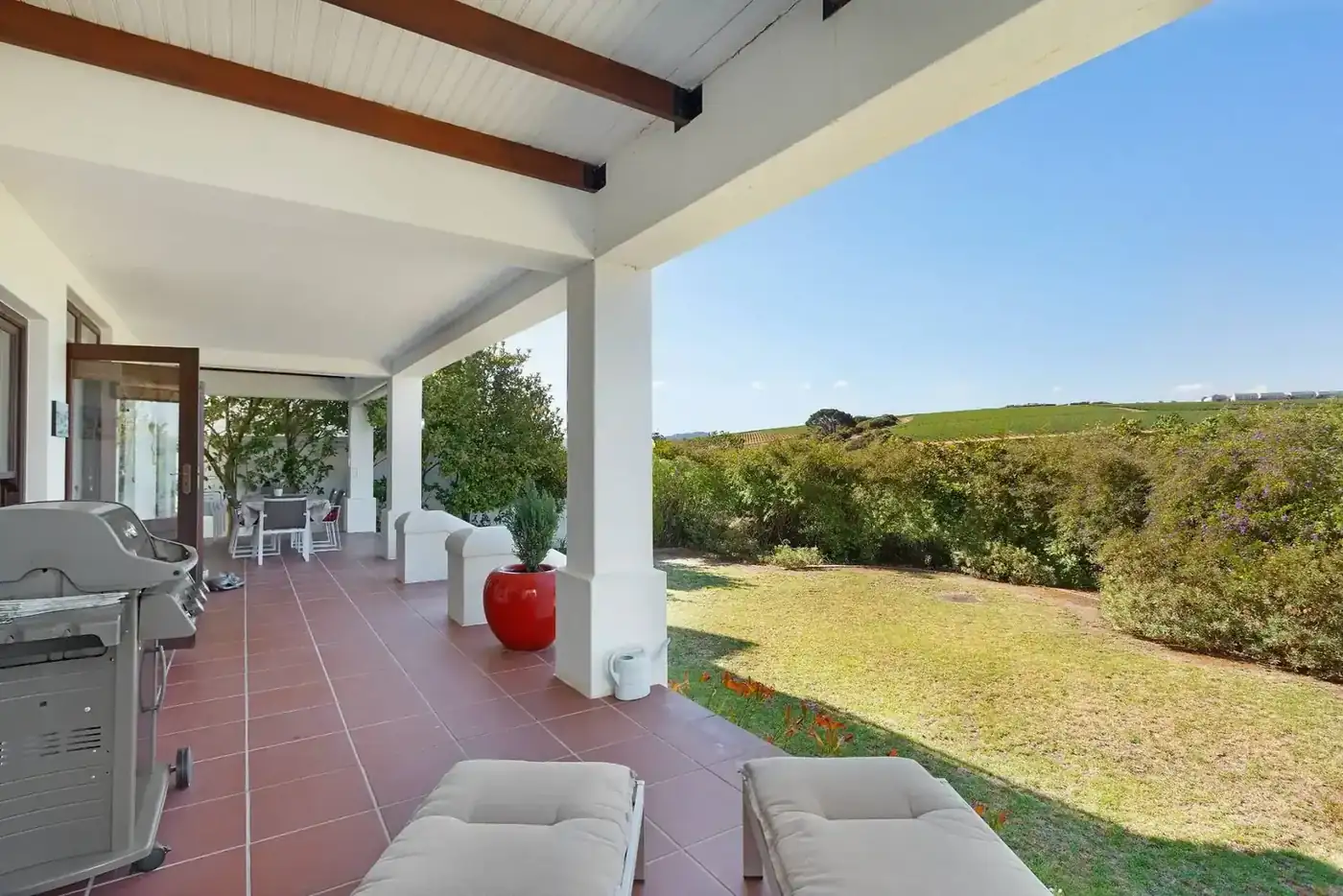 Lodge 1 outdoor patio with built-in braai with golf fairway views