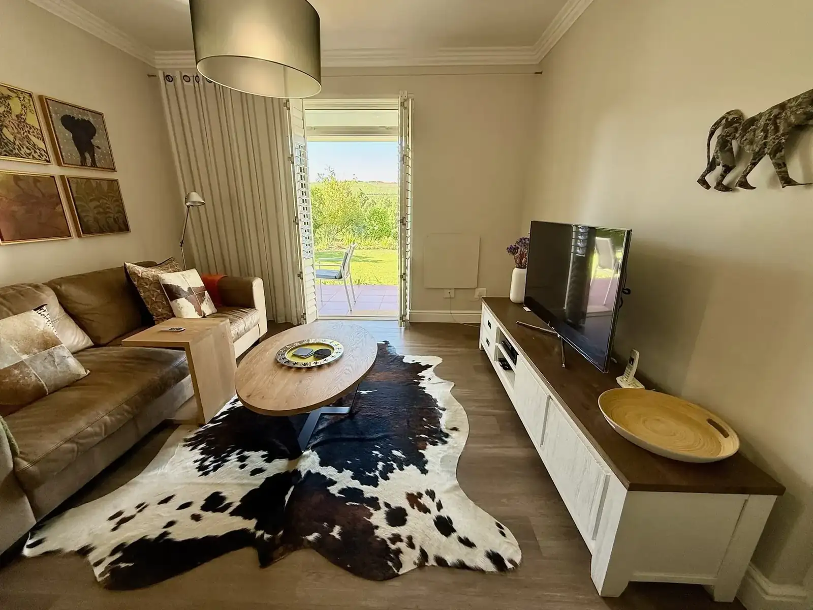 Lodge 4 open-plan lounge with golf fairway views