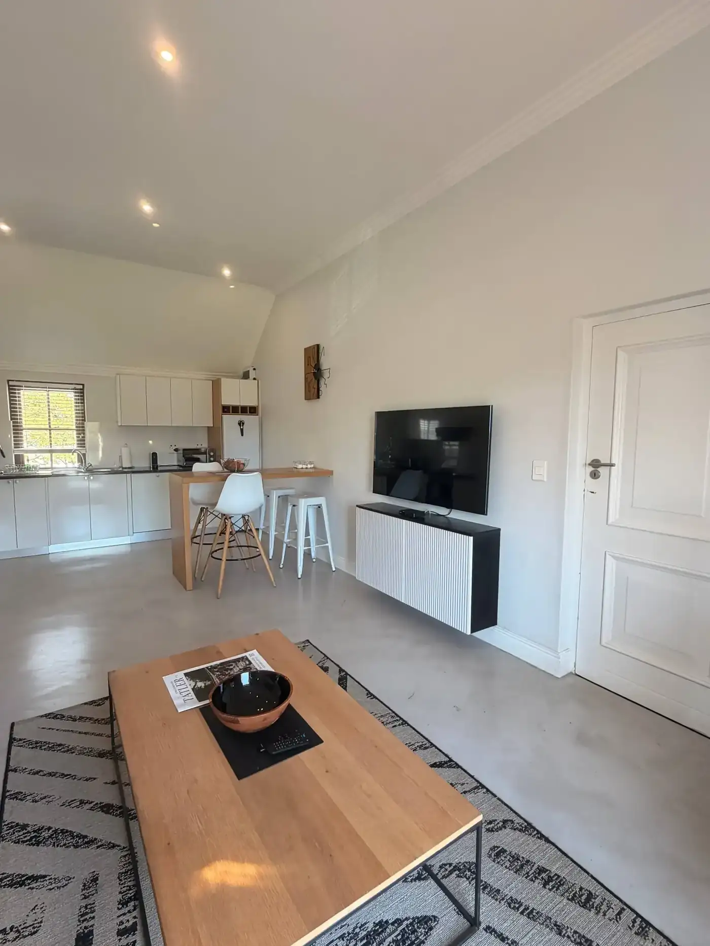 Lodge 8 open-plan lounge with golf fairway views