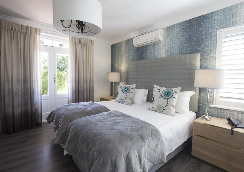Luxury lodge bedroom interior at Winelands Golf Lodges