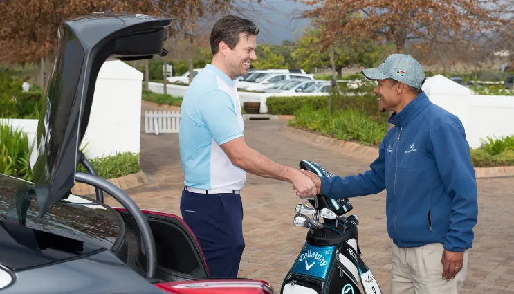 Golfer greeting staff
