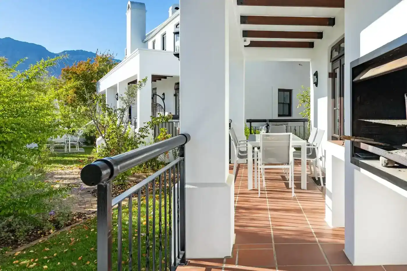 Lodge 26 outdoor patio with built-in braai with mountain views