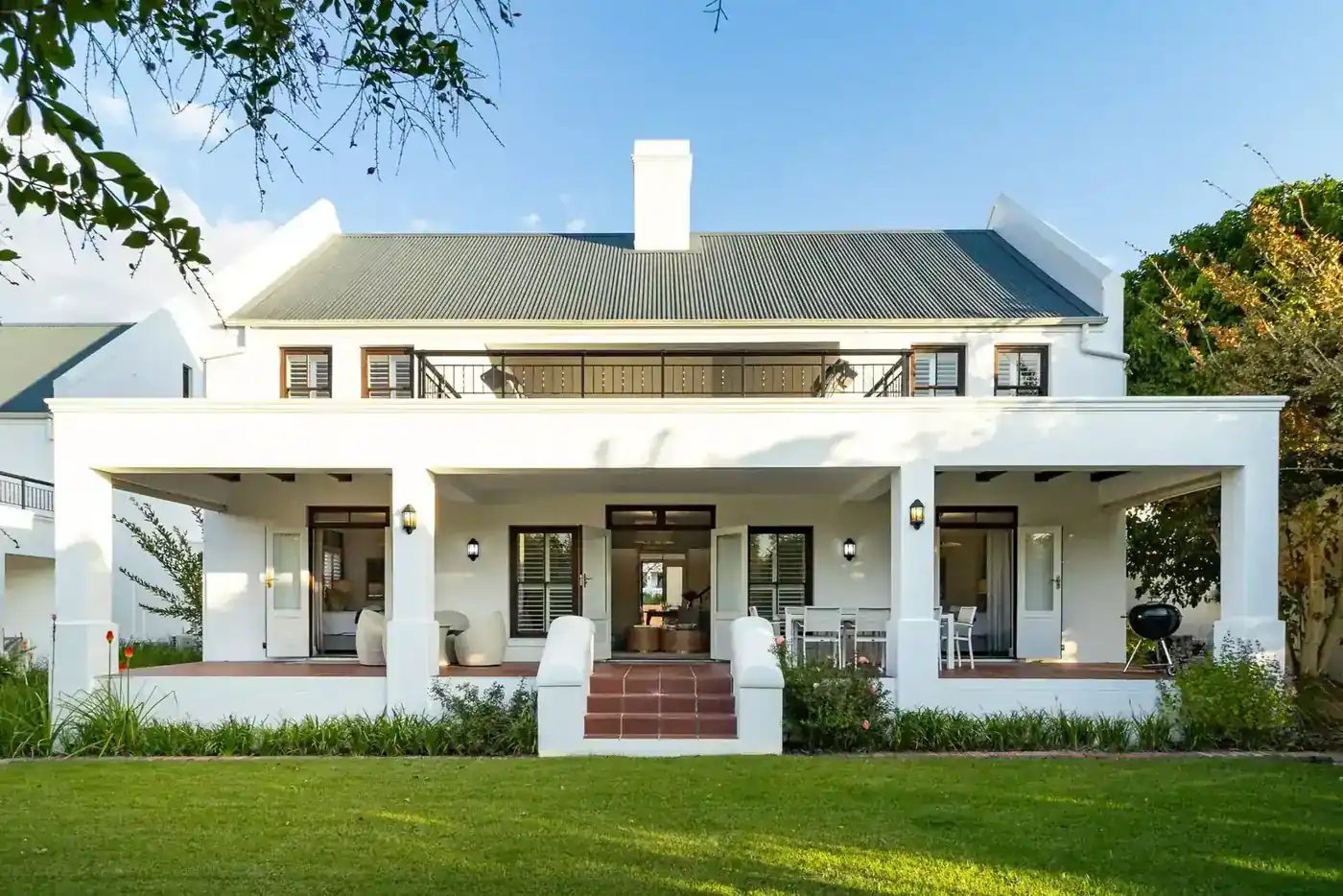 Lodge 3 outdoor patio with built-in braai with golf fairway views