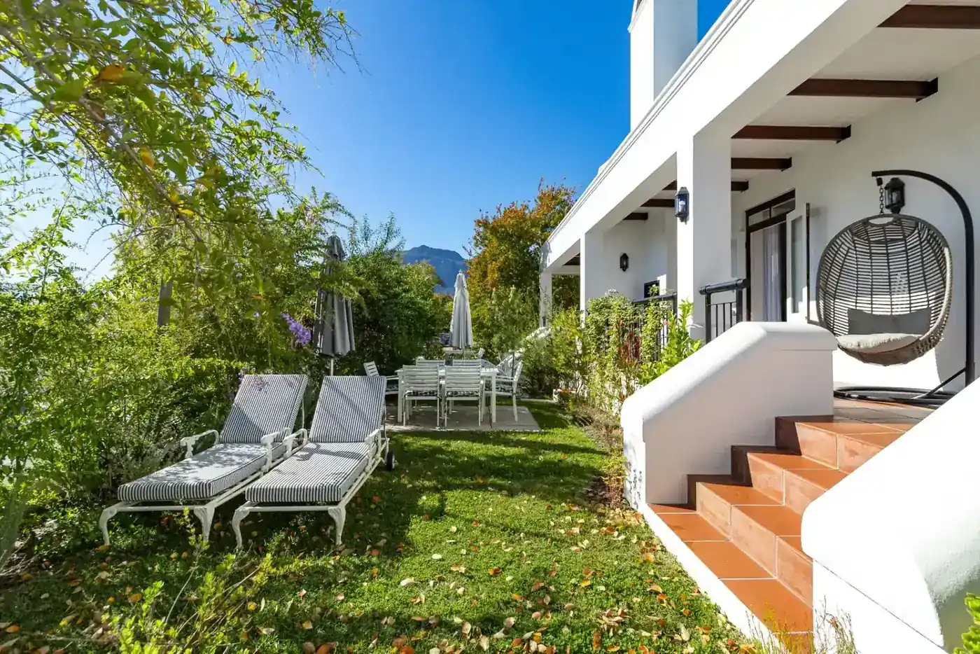 Luxury outdoor patio with built-in braai with mountain views