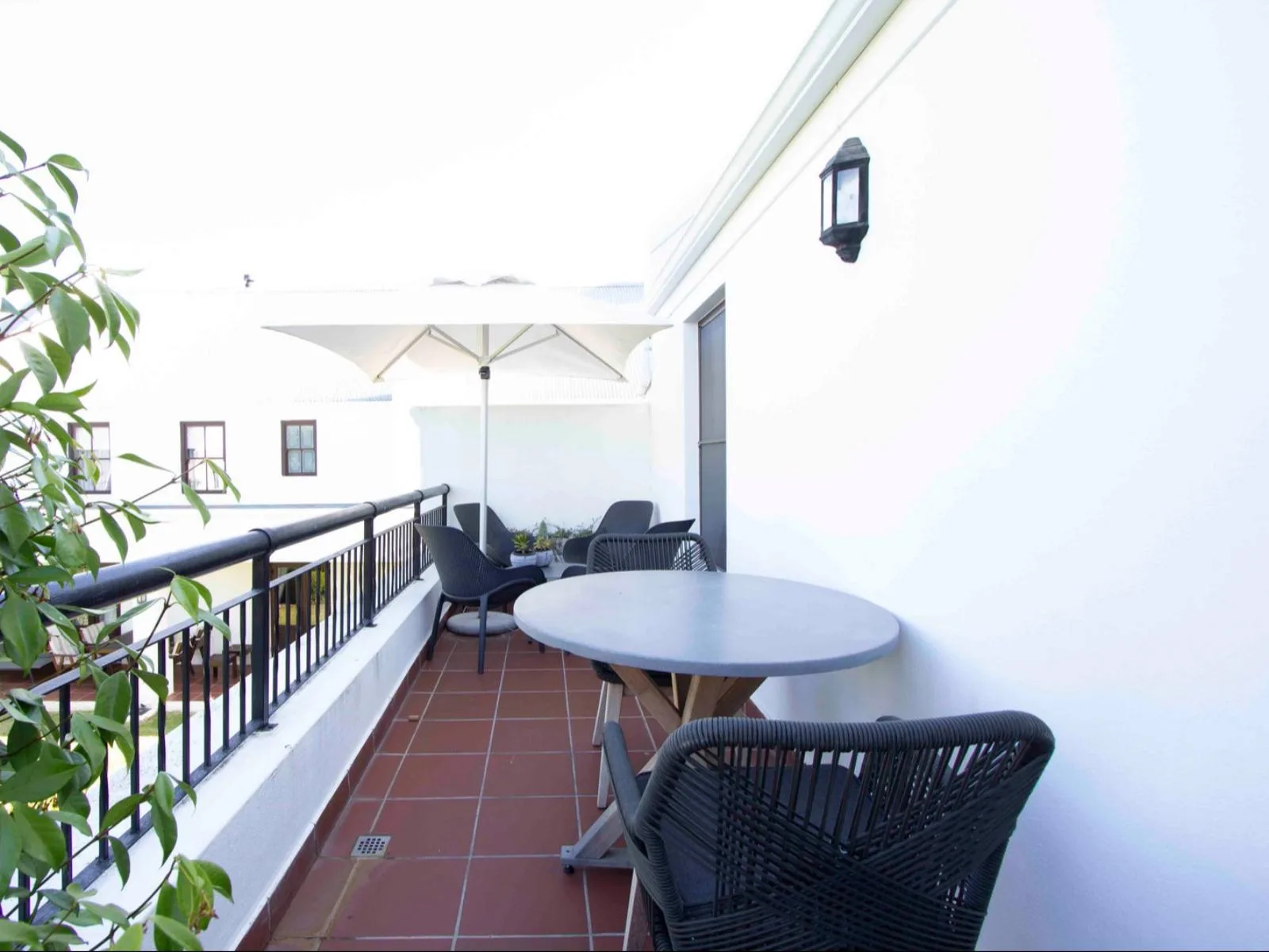 Lodge 36 outdoor patio with built-in braai with garden views