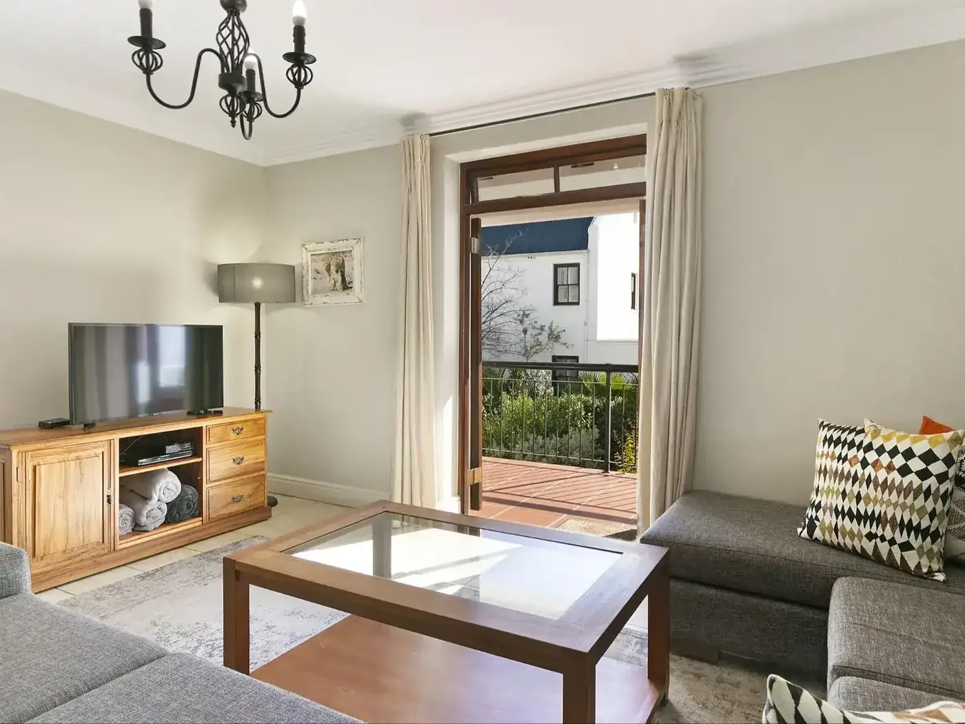 Superior living area with comfortable seating and TV